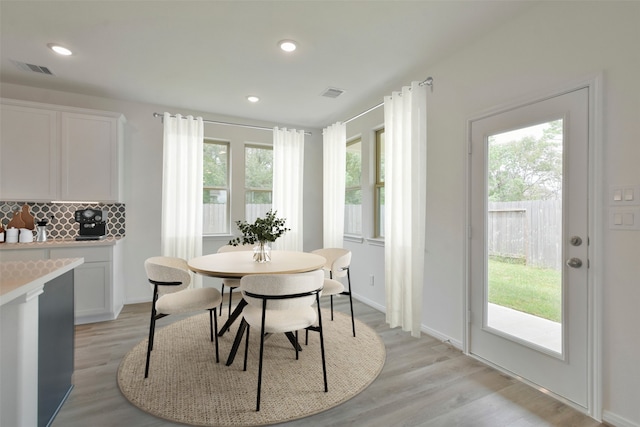 dining area with light hardwood / wood-style floors