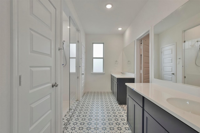 bathroom with walk in shower and vanity