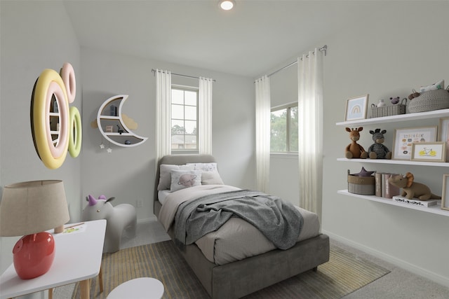 carpeted bedroom featuring multiple windows