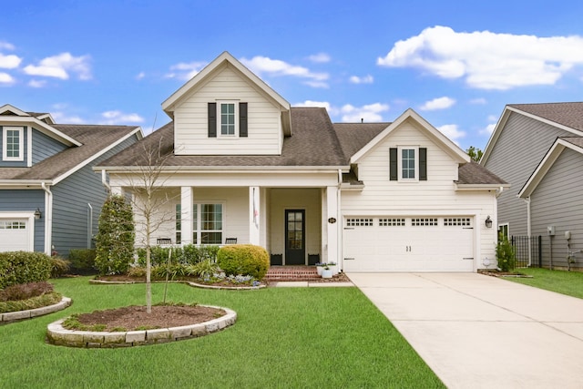 view of front of property featuring a garage, covered porch, and a front lawn