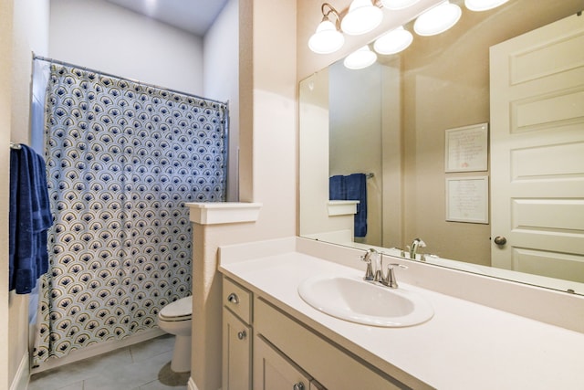 bathroom featuring tile patterned flooring, vanity, curtained shower, and toilet