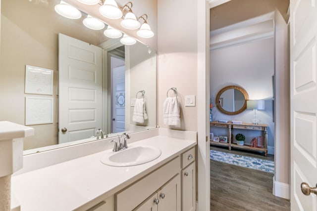 bathroom with vanity and hardwood / wood-style flooring