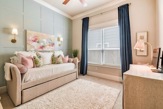 bedroom featuring crown molding, light colored carpet, and ceiling fan