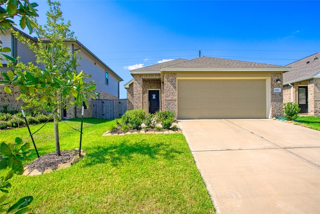 view of front of house featuring a garage and a front yard