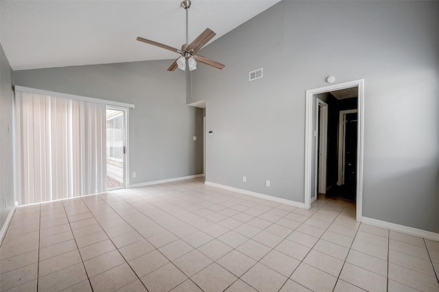 tiled spare room featuring ceiling fan and high vaulted ceiling