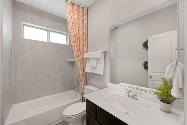 full bathroom featuring vanity, shower / bath combo, and toilet