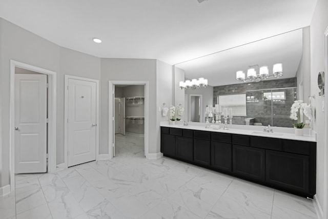 bathroom featuring vanity and an enclosed shower