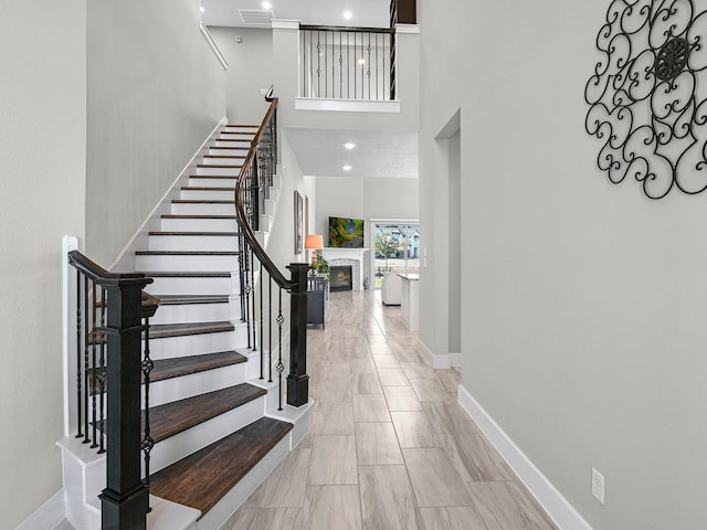 entryway featuring a towering ceiling