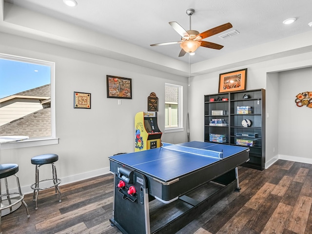 recreation room featuring ceiling fan and dark hardwood / wood-style floors