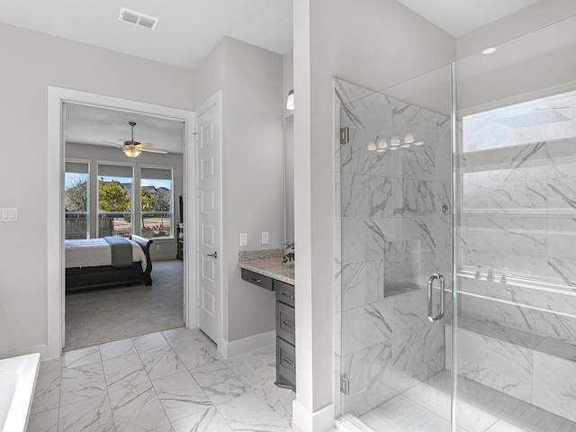 bathroom featuring vanity, a shower with shower door, and ceiling fan