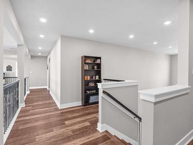 hallway with dark wood-type flooring