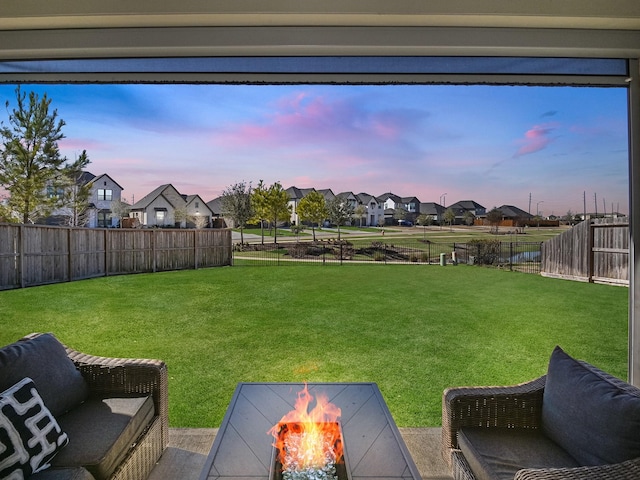 yard at dusk with a fire pit