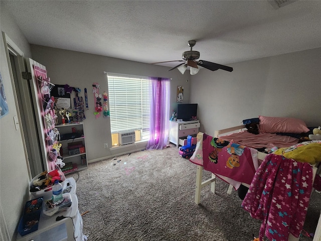 bedroom featuring cooling unit, ceiling fan, a textured ceiling, and carpet flooring