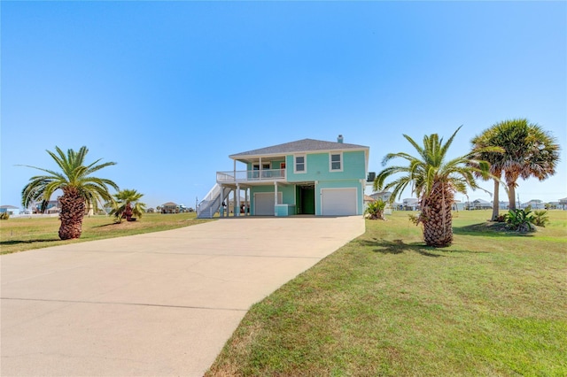 view of front of home with a garage and a front yard