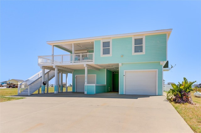 view of front of property with a garage, a balcony, and a carport