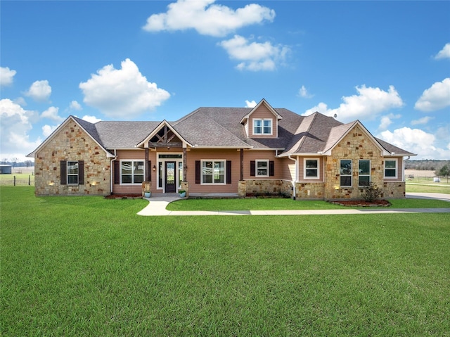 craftsman-style home featuring a front lawn