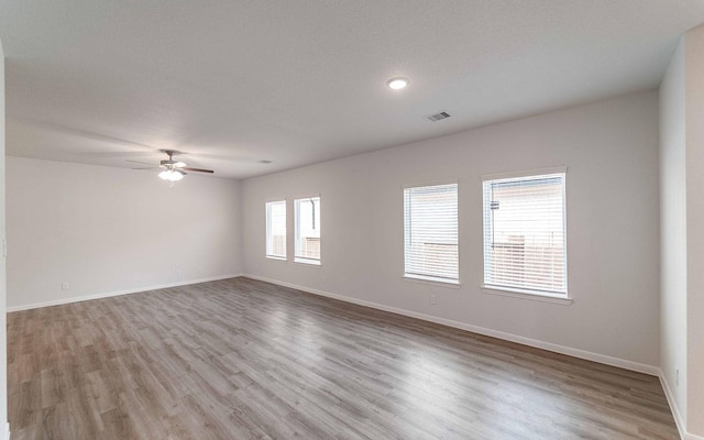 10791 Sora Dr, Willis, TX 77378 - empty room featuring visible vents, wood finished floors, baseboards, and ceiling fan