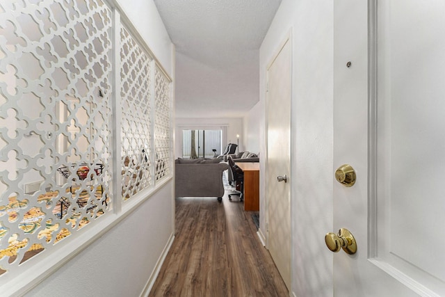 corridor with dark wood-type flooring