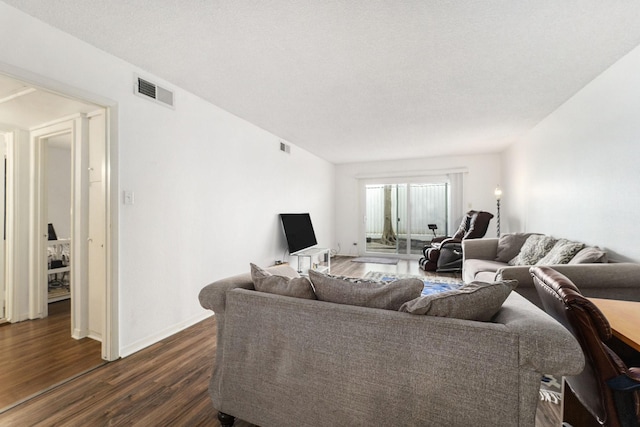 living room with dark hardwood / wood-style floors