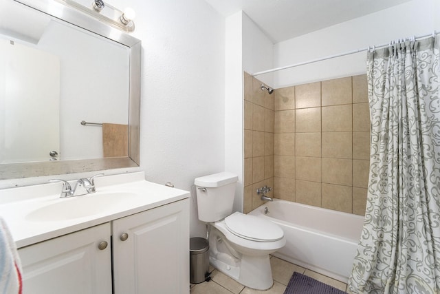 full bathroom featuring tile patterned flooring, shower / tub combo, vanity, and toilet