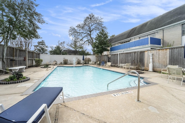 view of swimming pool featuring a patio area