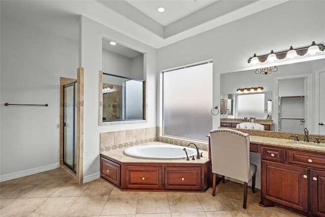 bathroom featuring tile patterned floors, vanity, and independent shower and bath