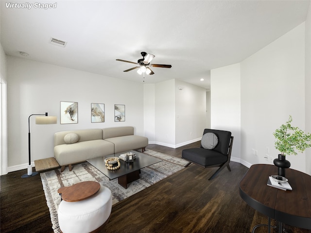 living room with hardwood / wood-style flooring and ceiling fan