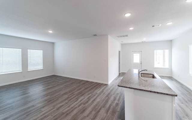 10775 Sora Dr, Willis, TX 77378 - interior space with a sink, visible vents, recessed lighting, dark wood-style floors, and baseboards