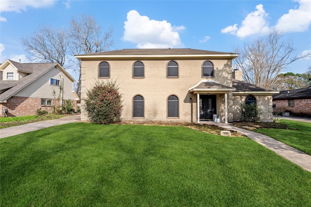 view of front facade with a front lawn