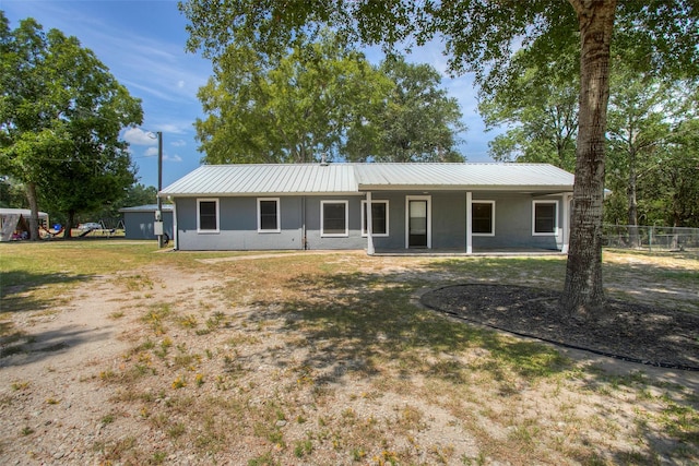 81 Fm 3454th Rd, Huntsville, TX 77320 - single story home with a metal roof