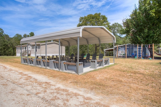 81 Fm 3454th Rd, Huntsville, TX 77320 - view of property's community featuring a detached carport, a playground, and a lawn