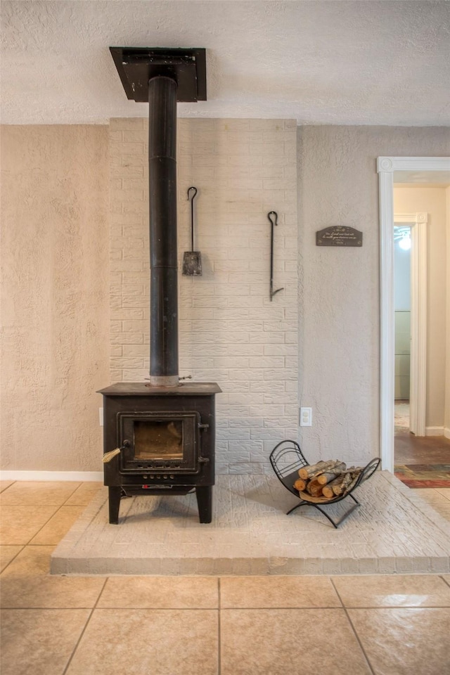 81 Fm 3454th Rd, Huntsville, TX 77320 - detailed view of a textured ceiling, a textured wall, and a wood stove