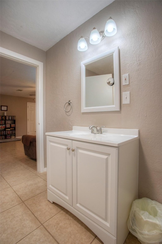 81 Fm 3454th Rd, Huntsville, TX 77320 - bathroom featuring a textured wall, tile patterned floors, and vanity