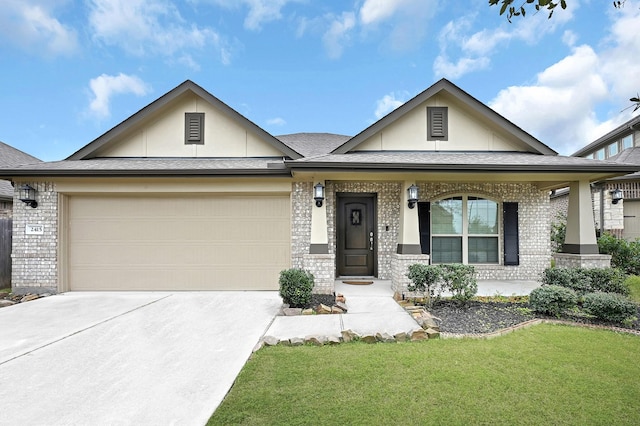 view of front of house featuring a garage, covered porch, and a front yard