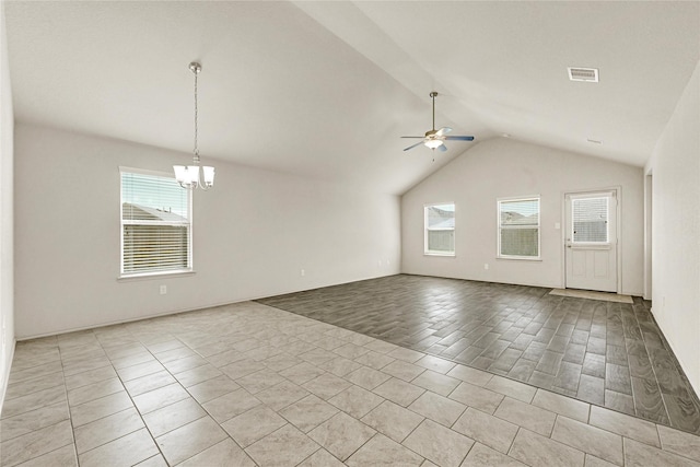 tiled empty room featuring lofted ceiling, a healthy amount of sunlight, visible vents, and ceiling fan with notable chandelier