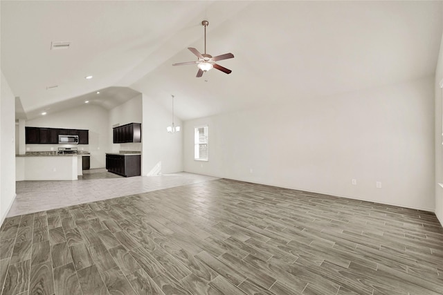 unfurnished living room featuring high vaulted ceiling, recessed lighting, ceiling fan with notable chandelier, visible vents, and wood tiled floor