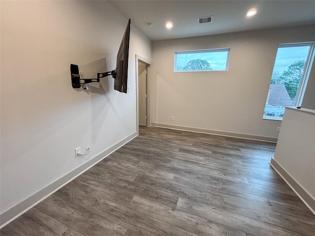 unfurnished room with dark hardwood / wood-style floors