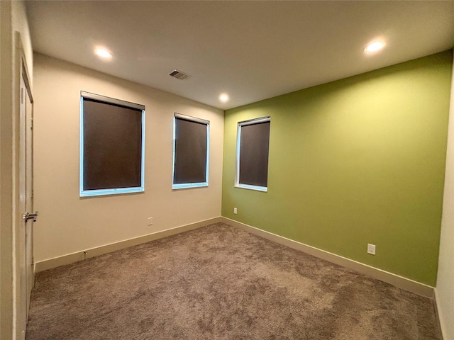 spare room with carpet floors