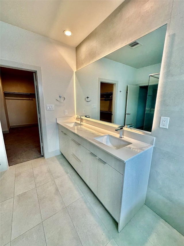 bathroom with vanity and tile patterned floors