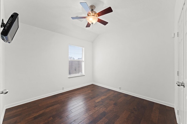 spare room featuring hardwood / wood-style flooring, ceiling fan, and lofted ceiling