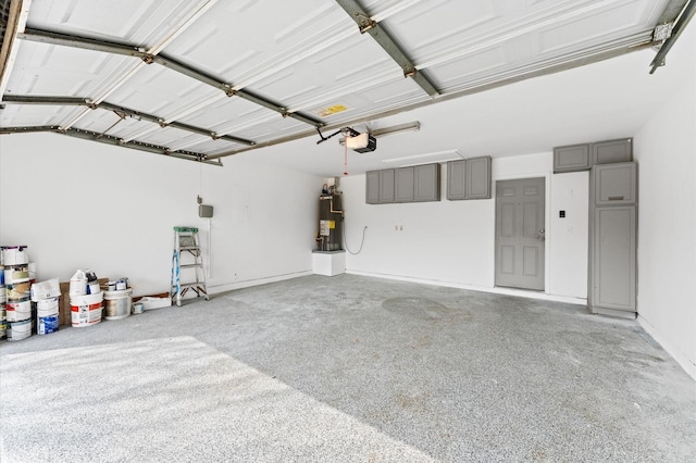 garage with a garage door opener and gas water heater