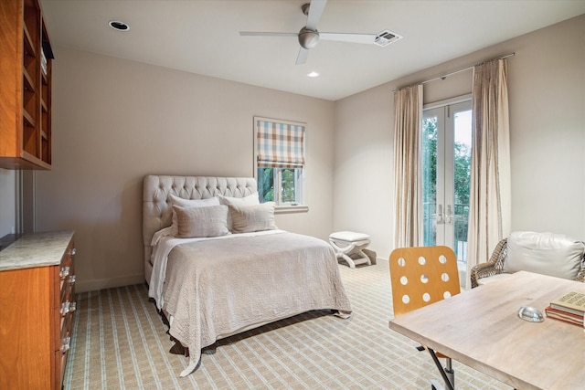 bedroom with ceiling fan, light colored carpet, and french doors