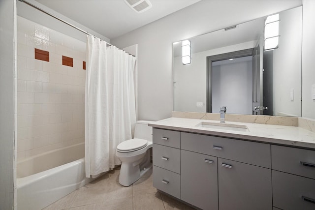 full bathroom featuring vanity, shower / tub combo, tile patterned floors, and toilet