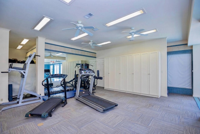 workout area featuring light colored carpet