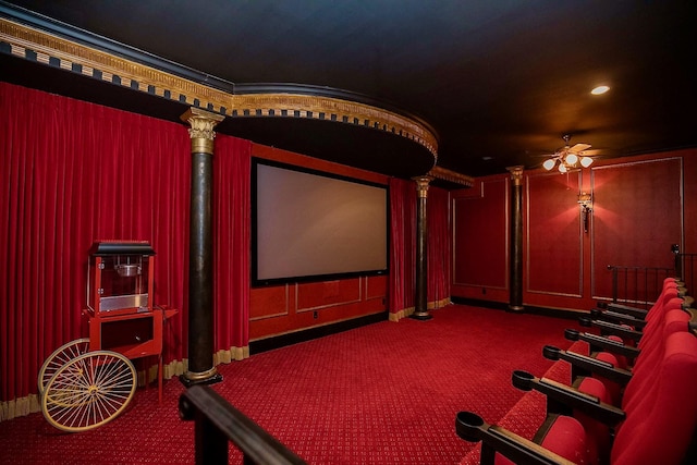 home theater room featuring ceiling fan and carpet flooring