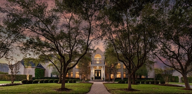 view of front of home with a yard