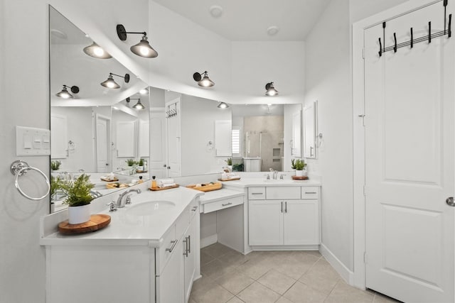 bathroom with tile patterned flooring, vanity, and a shower with shower door