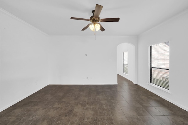 spare room featuring crown molding and ceiling fan