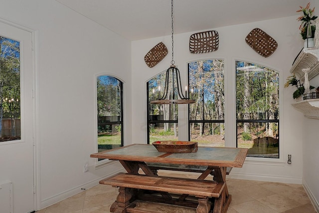 dining area with light tile patterned floors