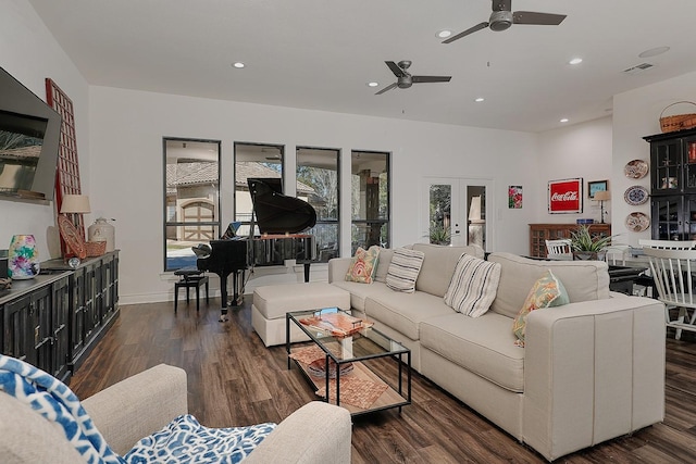 living room featuring ceiling fan, dark hardwood / wood-style flooring, and french doors